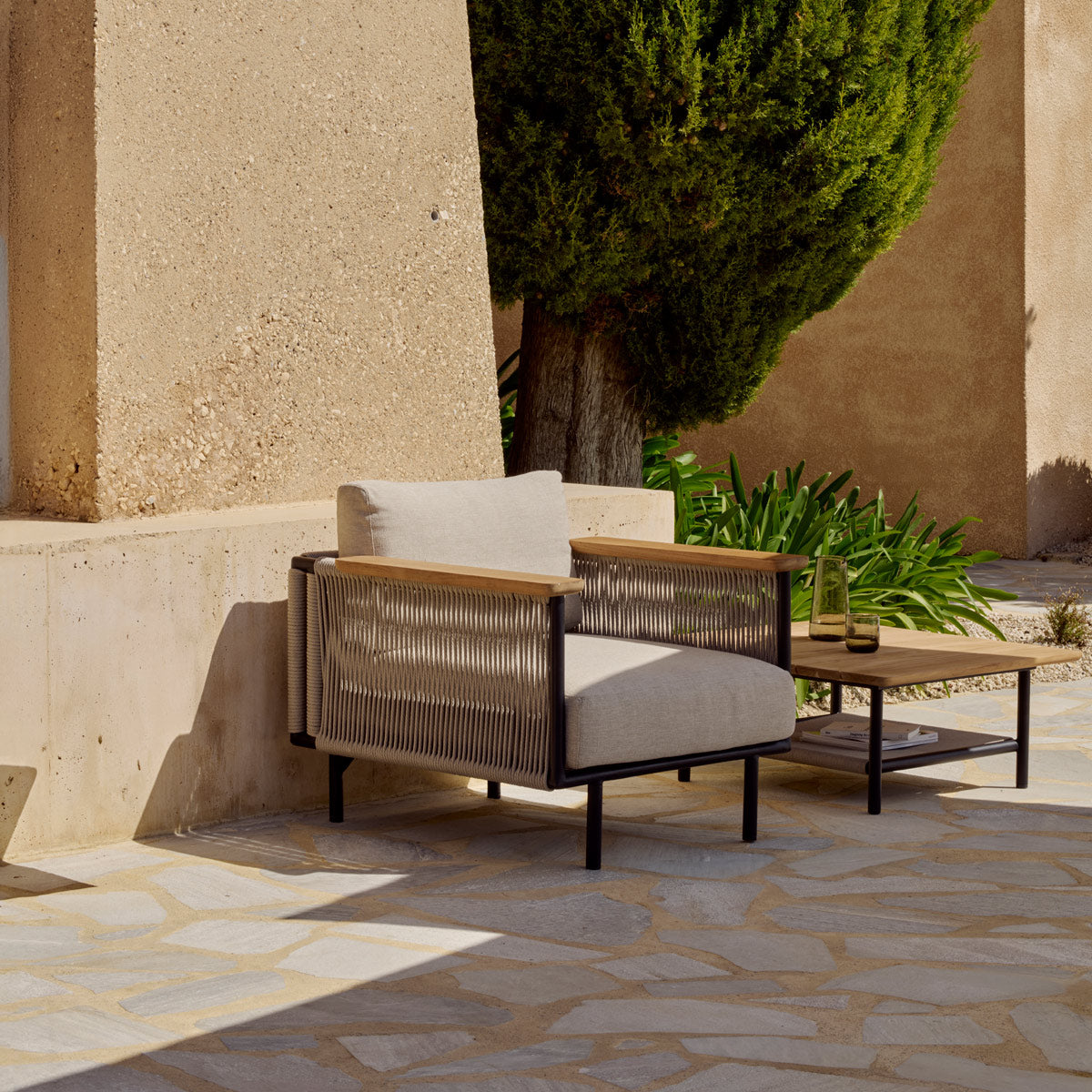 Corbey Outdoor Coffee Table by Ethnicraft, showing corbey outdoor coffee table in live shot.