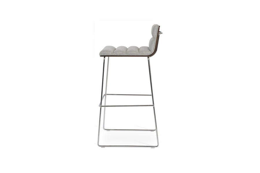 Corona Comfort Handle Back Wire Stool by SohoConcept, showing side view of corona comfort handle back wire stool in chrome wire/american walnut veneer plywood/camira blazer silver wool.