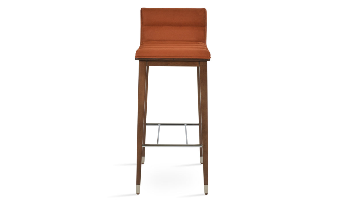 Corona Comfort Wood Stool by SohoConcept, showing front view of corona comfort wood stool in beech walnut wood with chrome ring/nubuck cognac fabric.