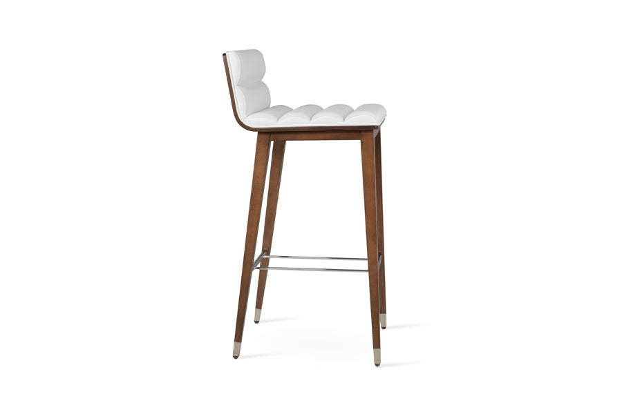 Corona Comfort Wood Stool by SohoConcept, showing side view of corona comfort wood stool in beech walnut wood with chrome ring/white leatherette.