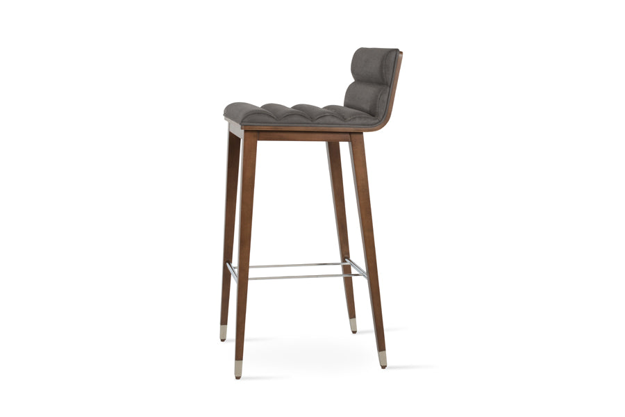 Corona Comfort Wood Stool by SohoConcept, showing side view of corona comfort wood stool in beech walnut wood with chrome ring/nubuck smoke grey fabric.