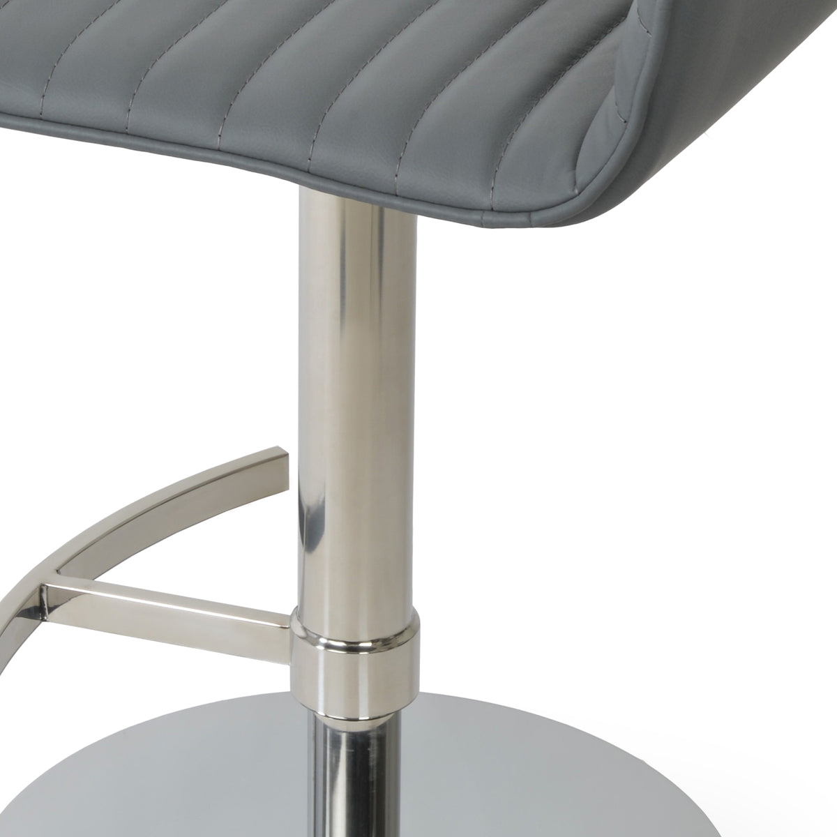 Corona Full Upholstery Piston Stool by SohoConcept, showing closeup view of corona full upholstery piston stool in round t-footrest/polished stainless steel/grey leatherette.