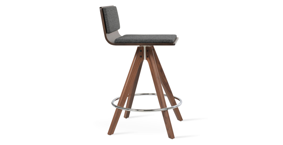 Corona Pyramid Swivel Bar Stool by SohoConcept, showing side view of corona pyramid swivel bar stool in original american walnut with white mechanism & chrome footrest/american walnut plywood seat/camira blazer dark grey wool.
