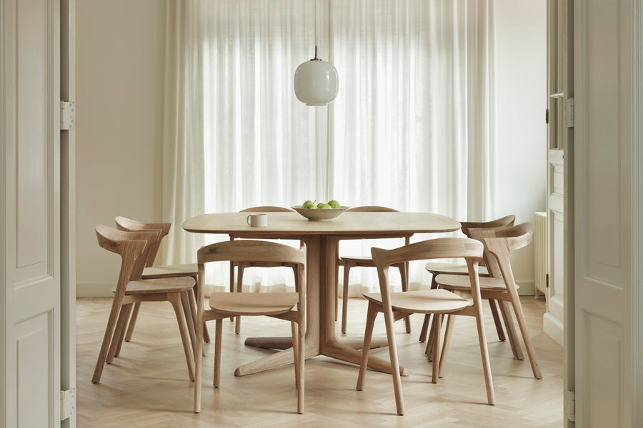Corto Dining Table by Ethnicraft, showing corto dining table in live shot.