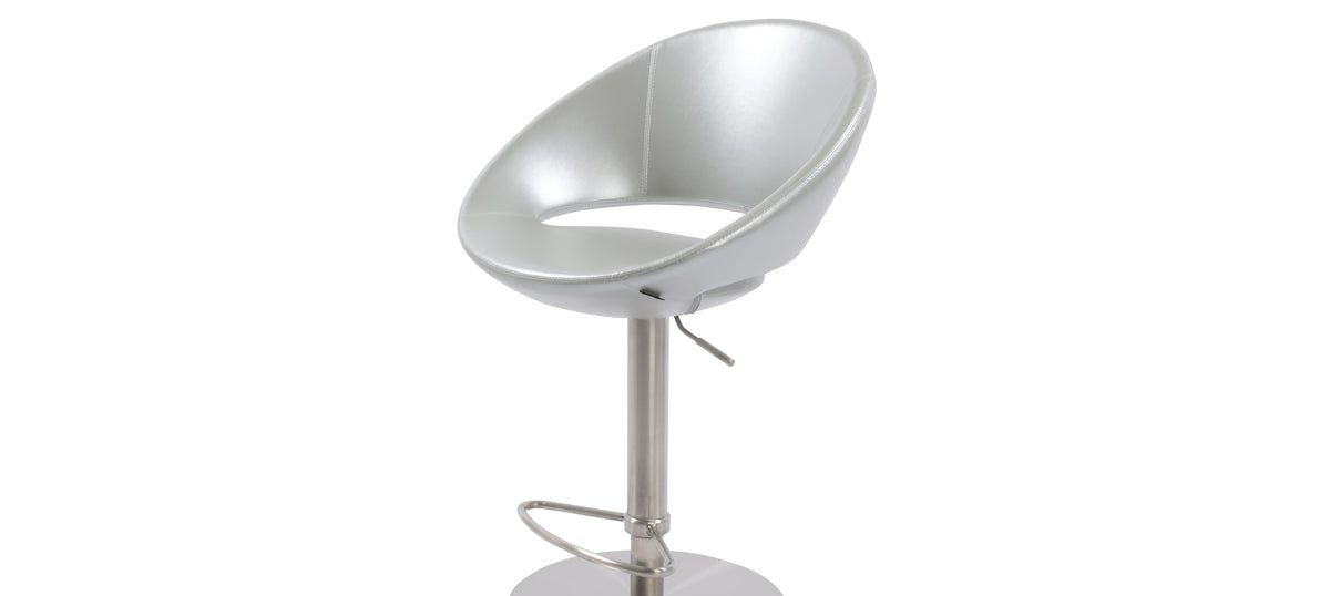 Crescent Piston Half Footrest Stool by SohoConcept, showing closeup view of crescent piston half footrest stool in round/brushed stainless steel/silver ppm.