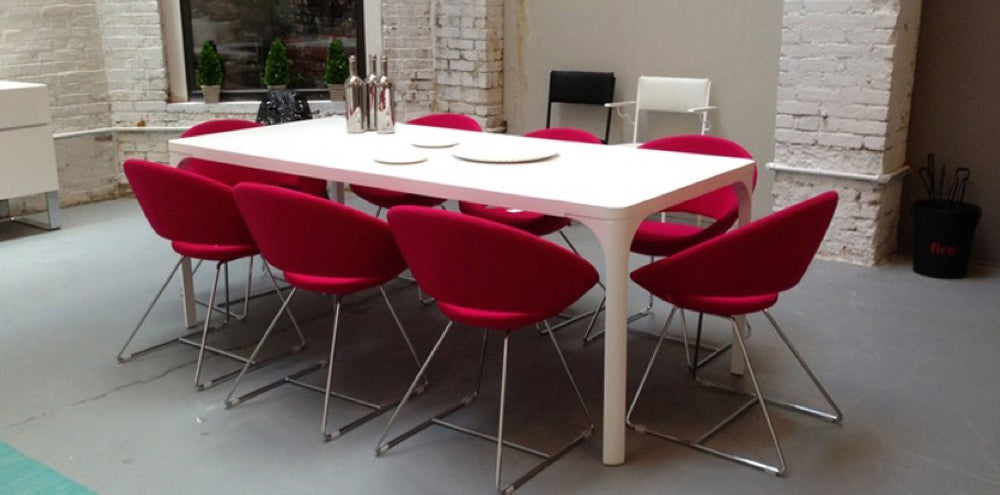 Crescent Wire Chair by SohoConcept, showing cresecent wire chairs in live shot.
