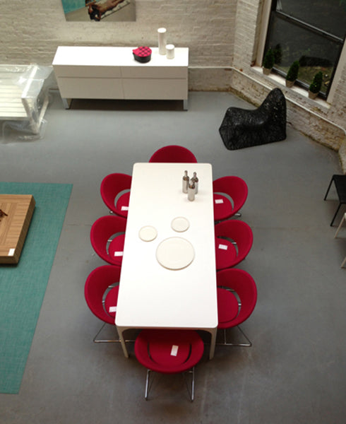 Crescent Wire Chair by SohoConcept, showing cresecent wire chairs in live shot.