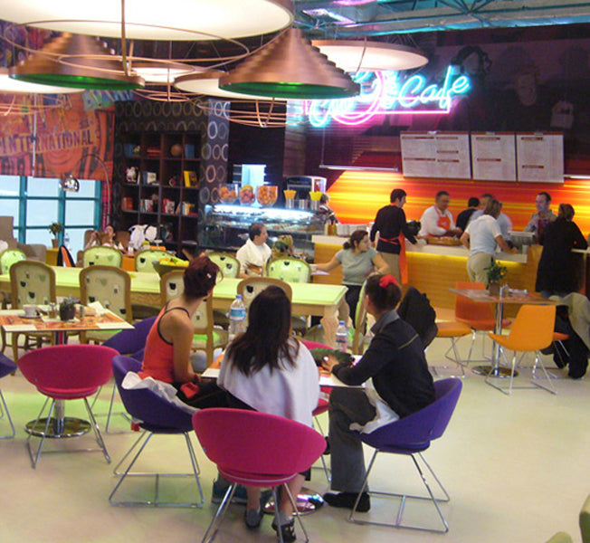 Crescent Wire Chair by SohoConcept, showing cresecent wire chairs in live shot.