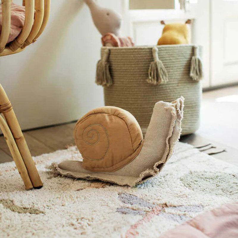 Lazy Snail Cushion by Lorena Canals, showing lazy snail cushion in live shot.