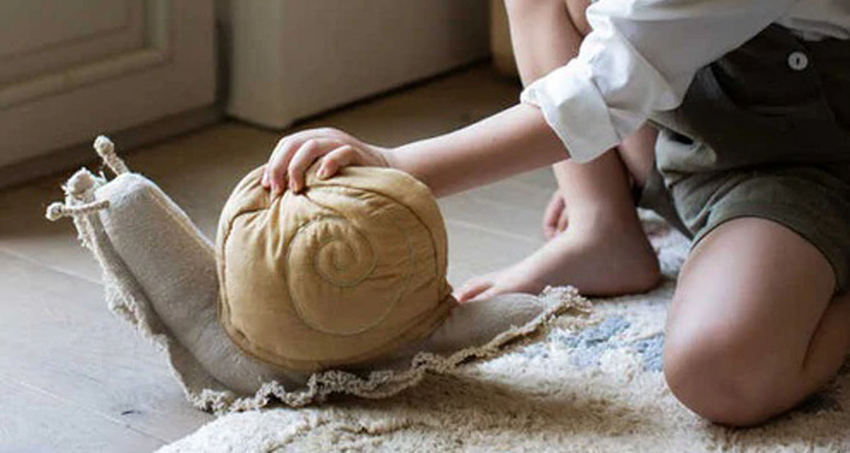 Lazy Snail Cushion by Lorena Canals, showing lazy snail cushion in live shot.
