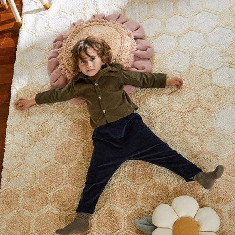 Planet Bee Floor Cushion by Lorena Canals, showing planet bee floor cushion in live shot.