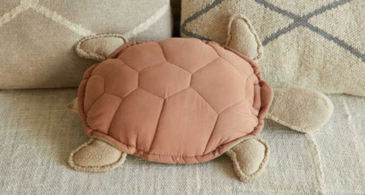 Sea Wonders Turtle Cushion by Lorena Canals, showing front view of sea wonders turtle cushion in live shot.
