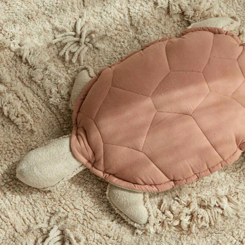 Sea Wonders Turtle Cushion by Lorena Canals, showing front view of sea wonders turtle cushion in live shot.