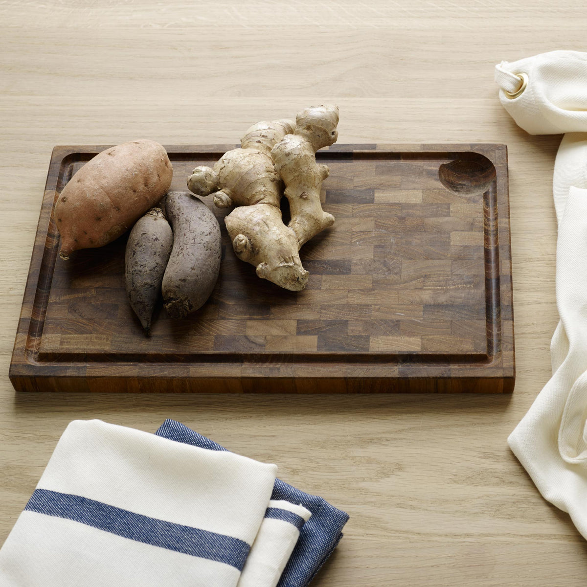 Dania Cutting Teak Board by Skagerak, showing cutting teak board in live shot.