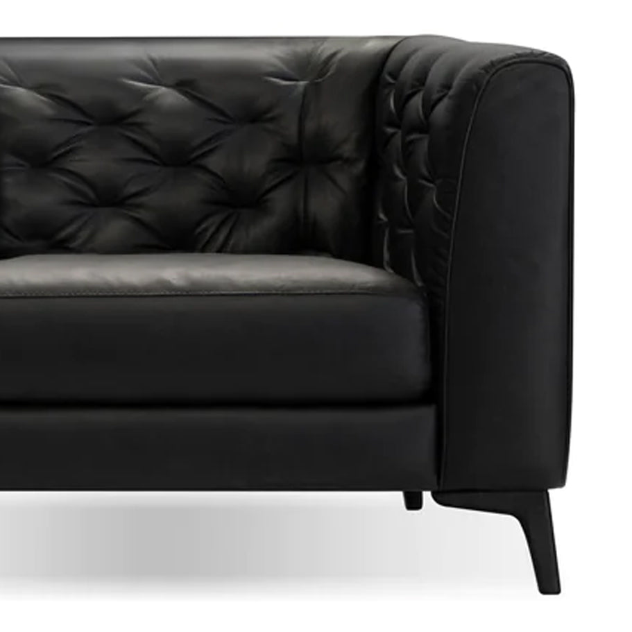 Dalton Lounge Chair by Mobital, showing closeup view of dalton lounge chair in vintage black leather/black powder coated legs.