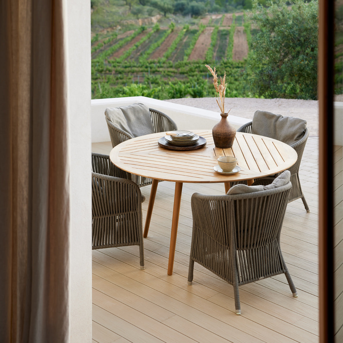 Define Dining Table by Cane-Line, showing define dining table in live shot.