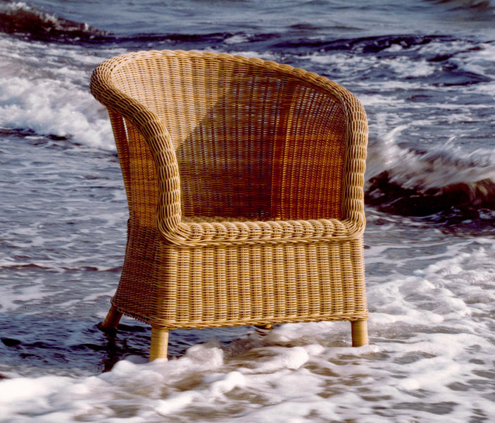 Derby Arm Chair by Cane-Line, showing derby arm chair in live shot.