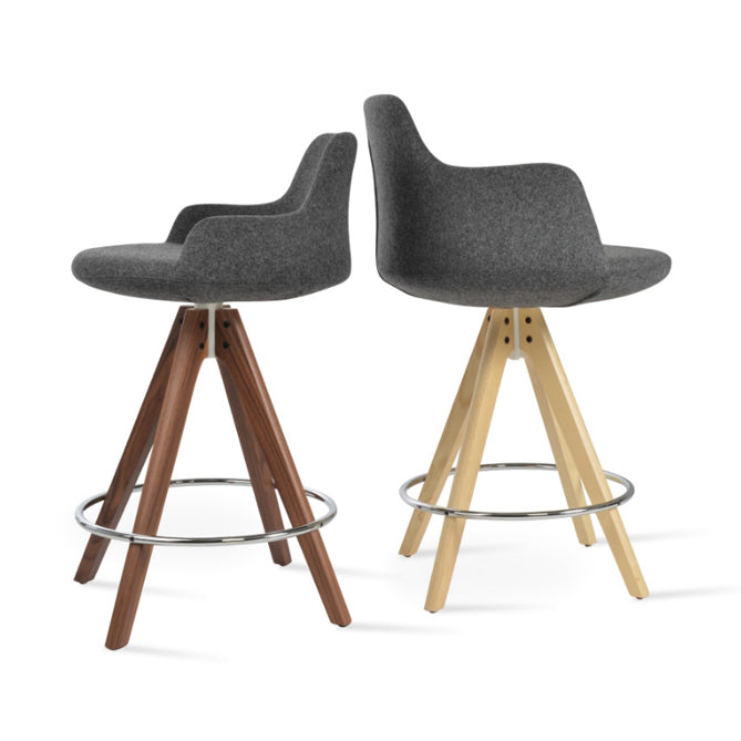 Dervish Pyramid Swivel Stool by SohoConcept, showing side views of dervish pyramid swivel stools in natural ash wood and original american walnut with white mechanism & chrome footrest/camira blazer dark grey wool.