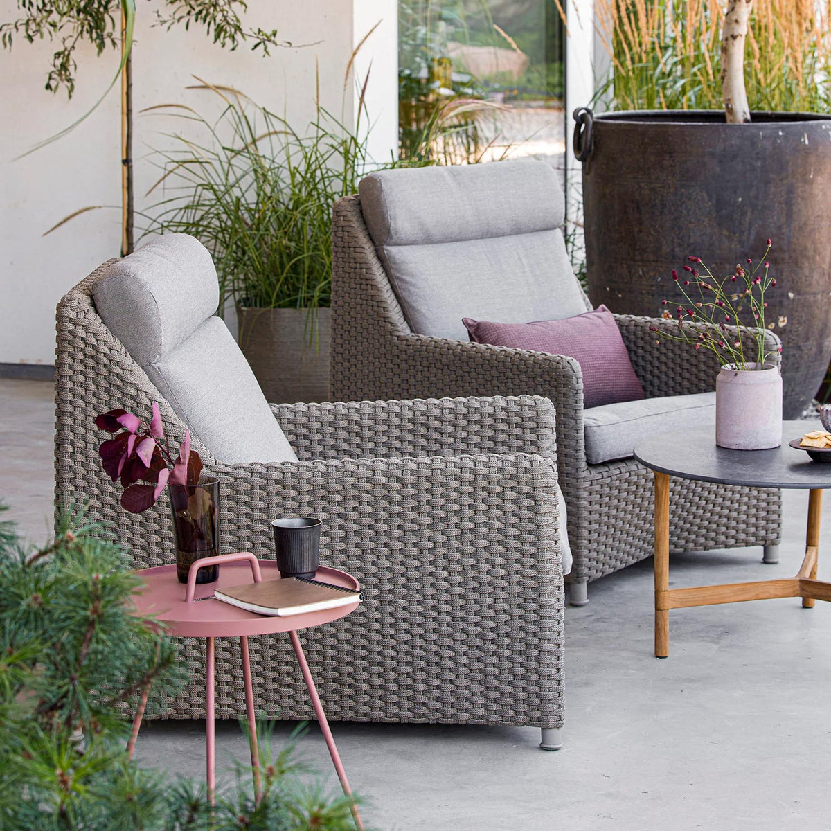 Diamond Highback Chair by Cane-Line, showing diamond highback chairs in live shot.