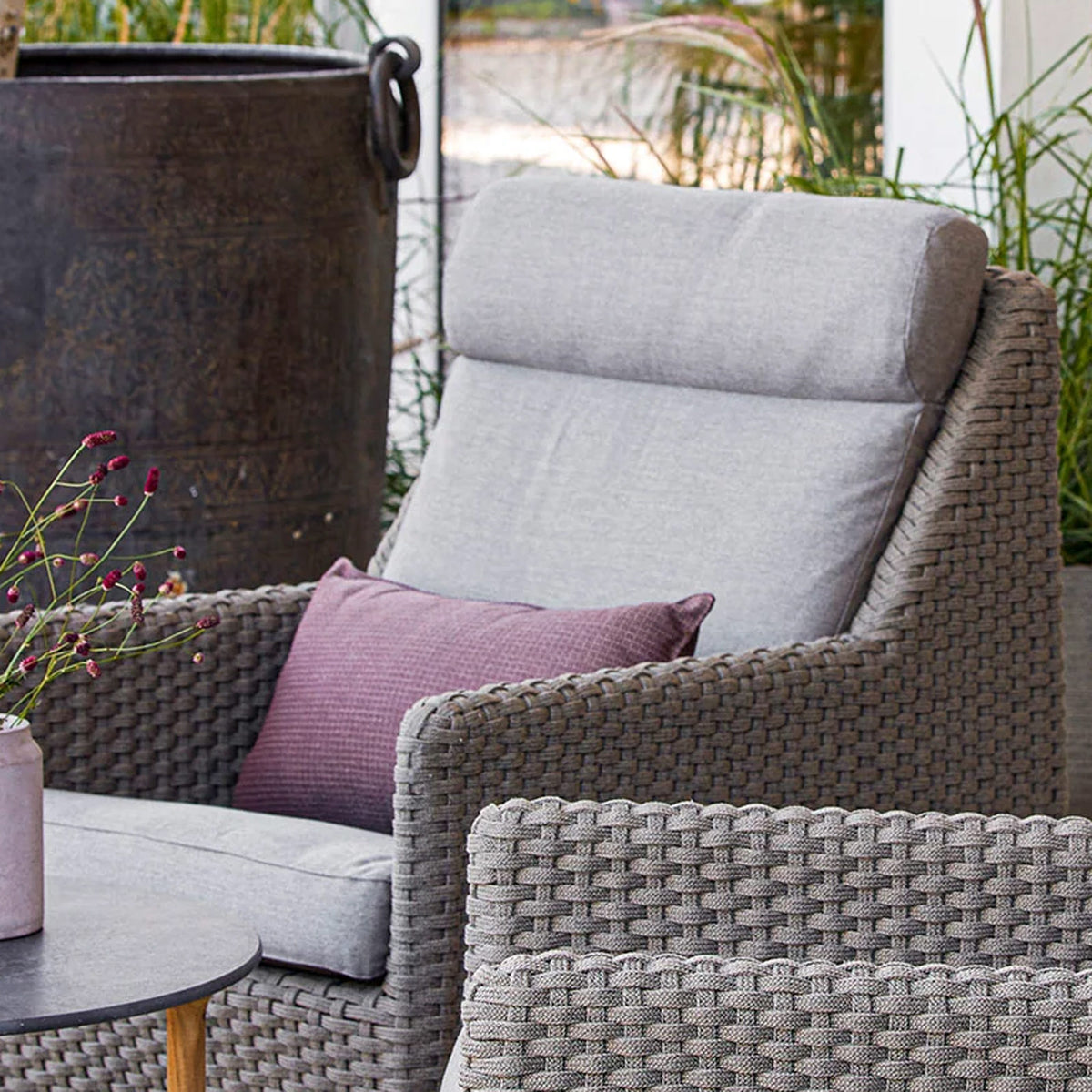 Diamond Highback Chair by Cane-Line, showing closeup view of diamond highback chairs in live shot.