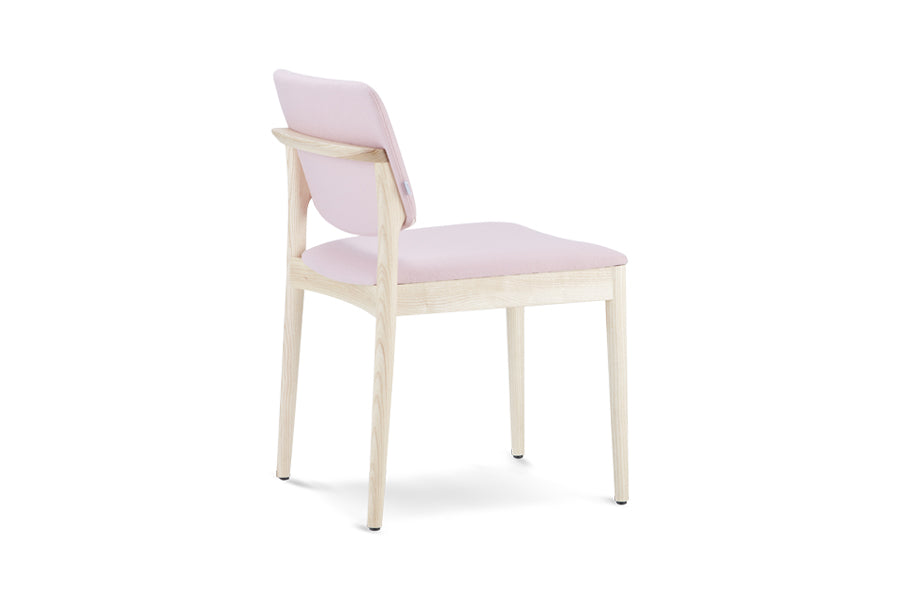 Dion Chair by B&T, showing side view of dion chair in seat & back fully upholstered/ash wood legs group.