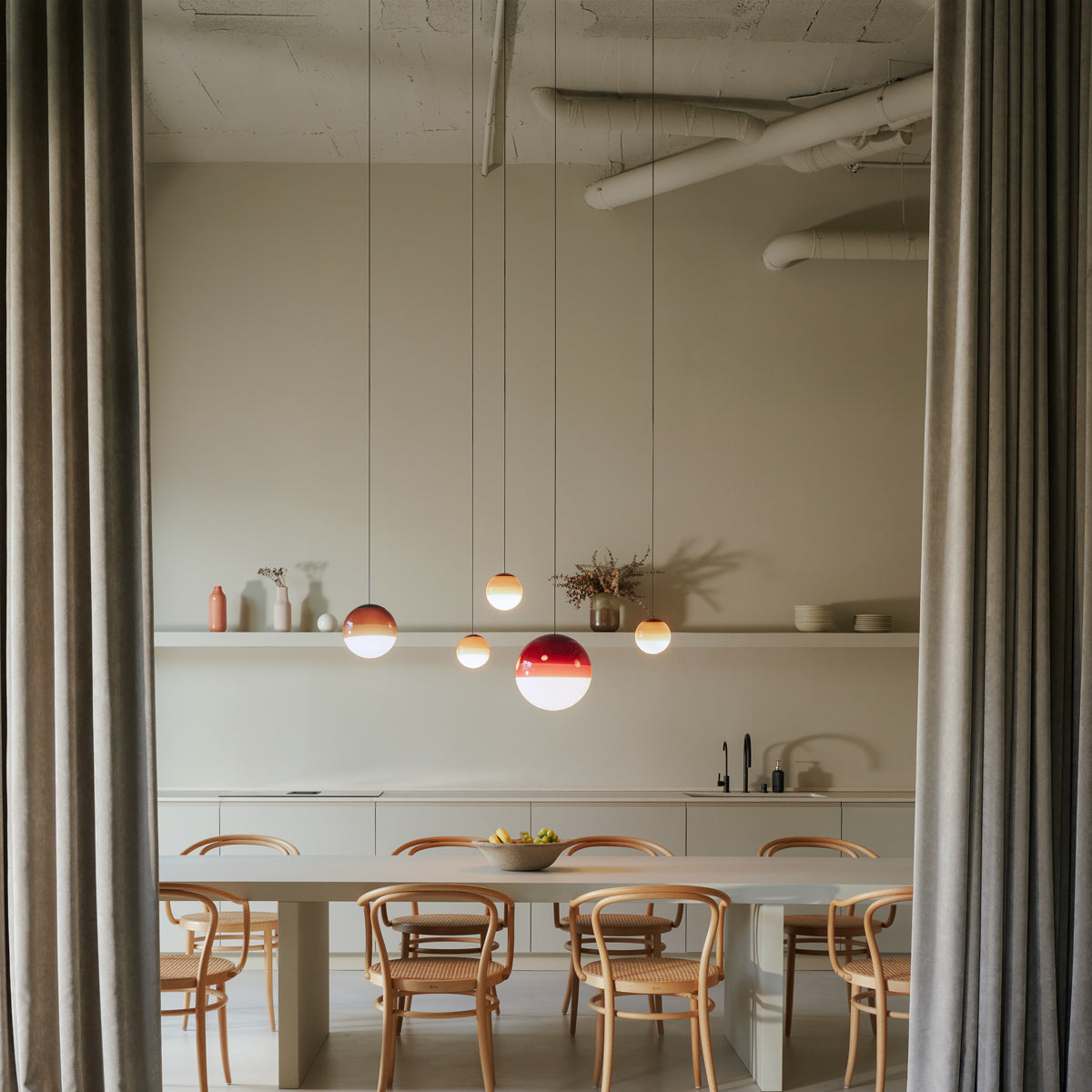Dipping ø11.8" 30V-24V Pendant Light by Marset, showing dipping ø11.8" 30v-24v pendant lights in live shot.