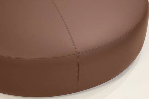 Disc Ottoman by Mobital, showing closeup view of disc ottoman in live shot.