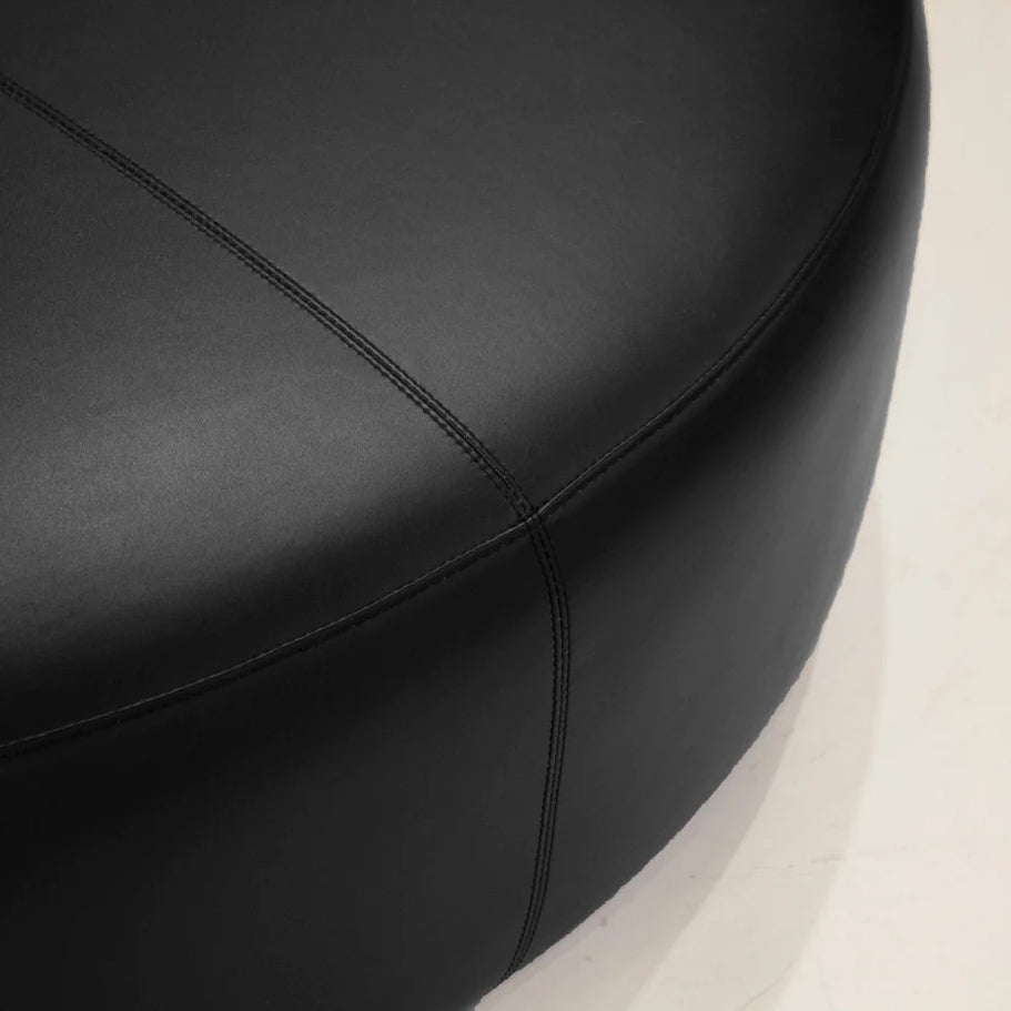 Disc Ottoman by Mobital, showing closeup view of disc ottoman in live shot.
