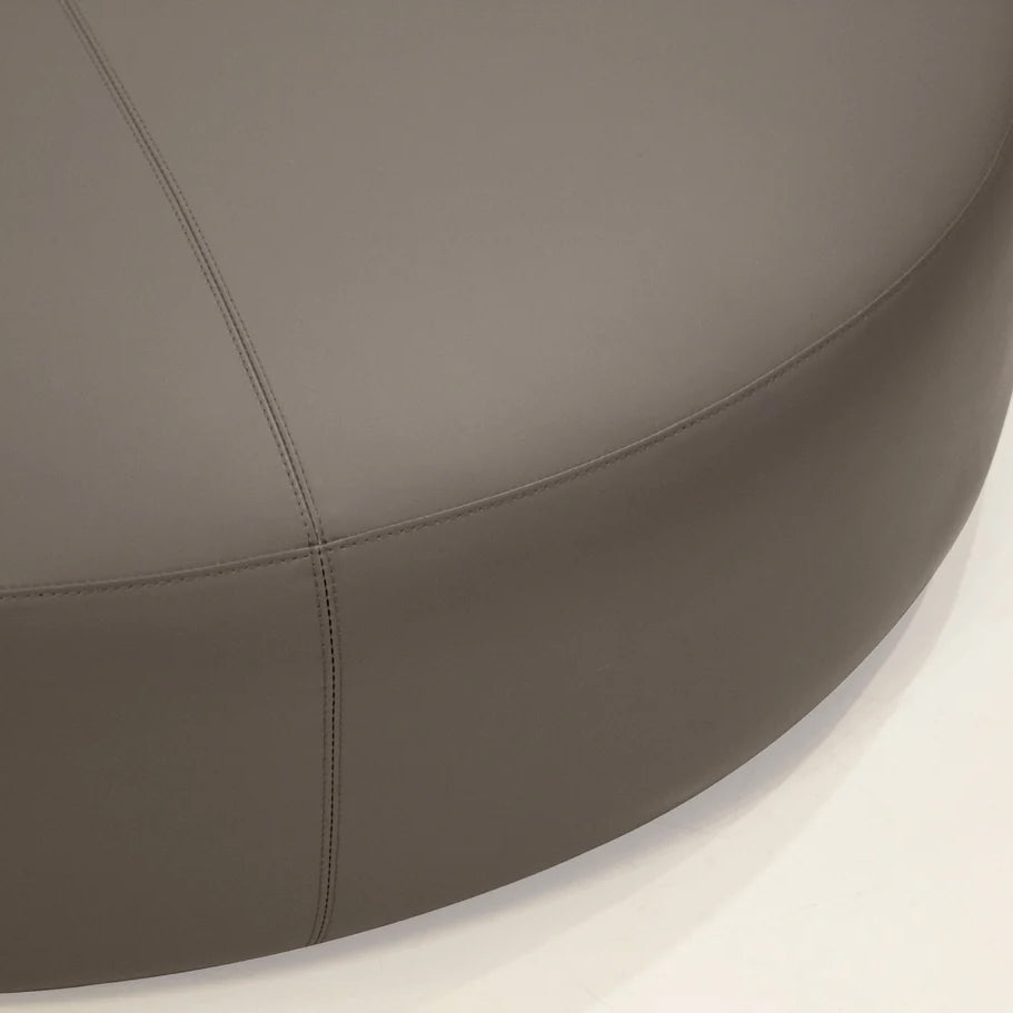 Disc Ottoman by Mobital, showing closeup view of disc ottoman in live shot.