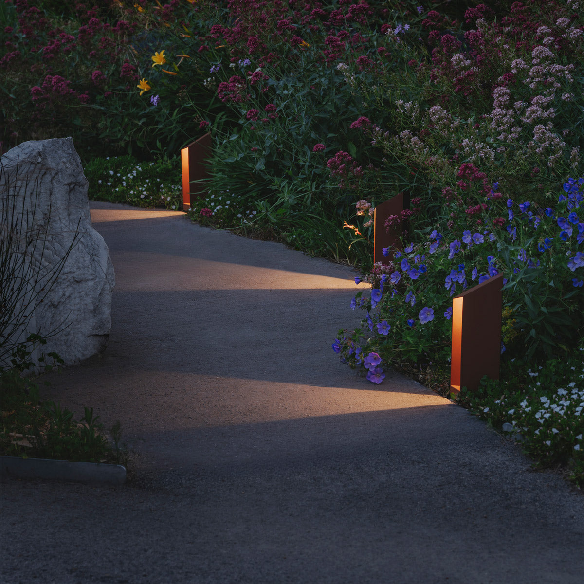 Domus Bollard Outdoor Light by Marset, showing domus bollard outdoor lights in live shot.