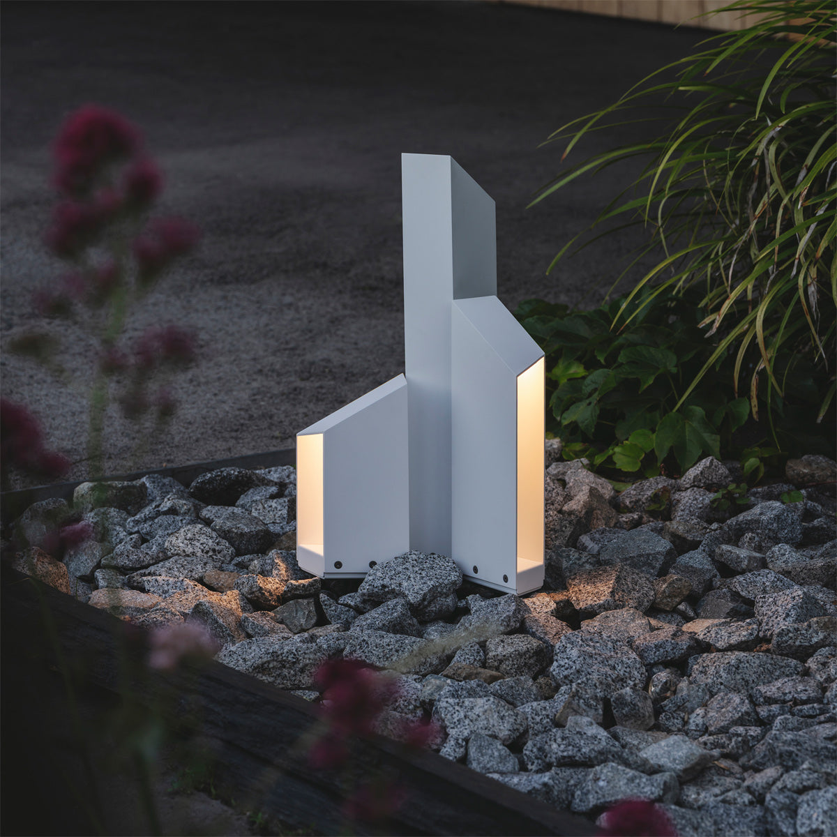 Domus Bollard Outdoor Light by Marset, showing domus bollard outdoor lights in live shot.