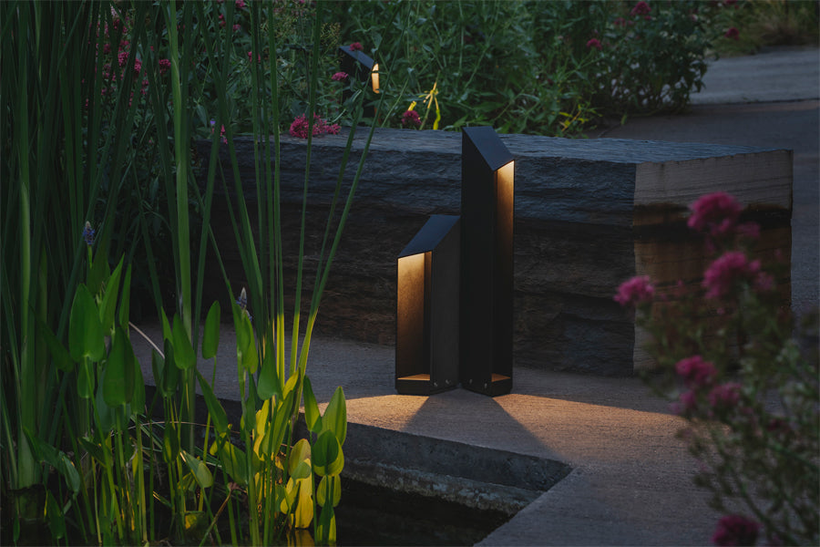 Domus Bollard Outdoor Light by Marset, showing domus bollard outdoor lights in live shot.