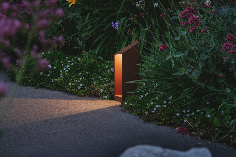Domus Bollard Outdoor Light by Marset, showing domus bollard outdoor light in live shot.
