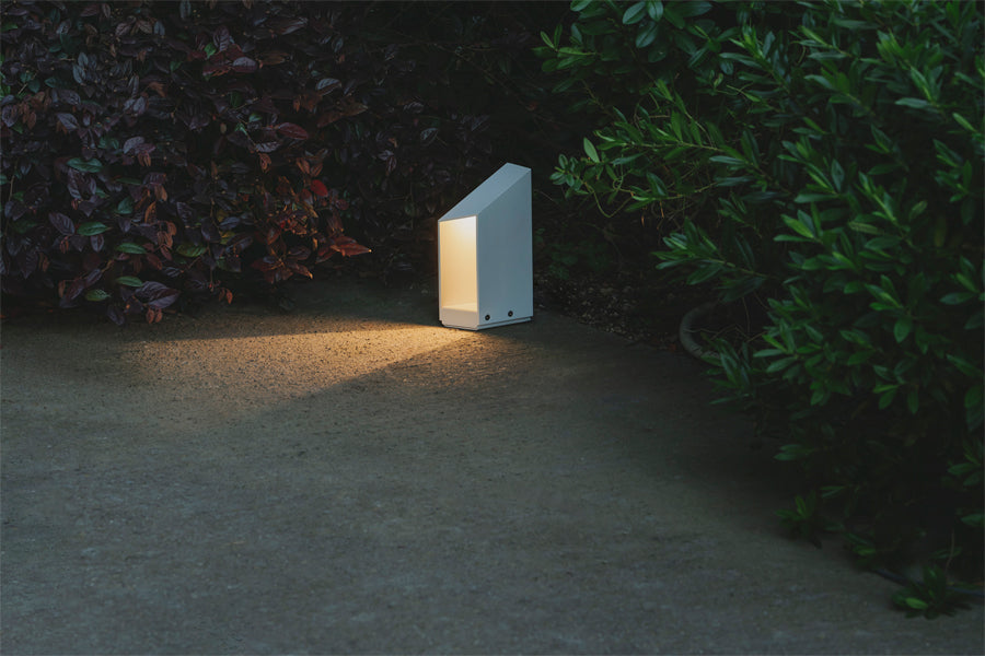 Domus Bollard Outdoor Light by Marset, showing domus bollard outdoor light in live shot.
