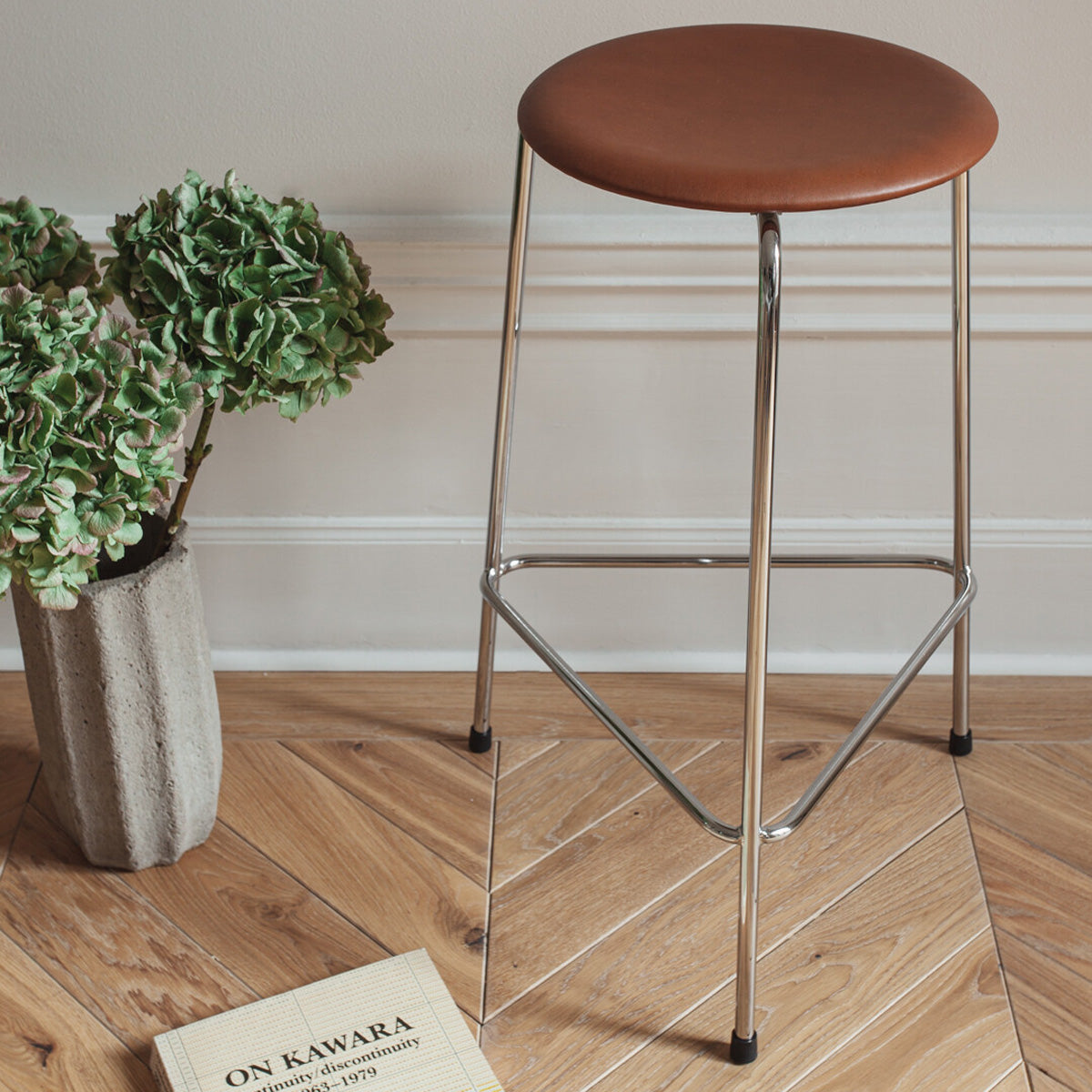 Dot High Stool by Fritz Hansen, showing dot high stool in live shot.