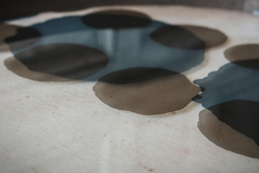 Dots Glass Tray by Ethnicraft, showing closeup view of dots glass tray in live shot.