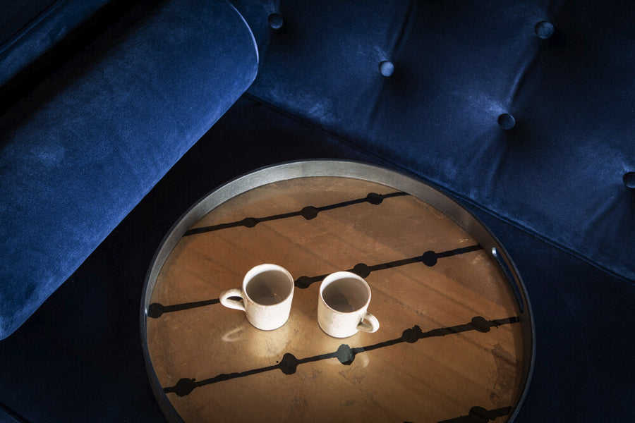 Dots Glass Tray by Ethnicraft, showing closeup view of dots glass tray in live shot.