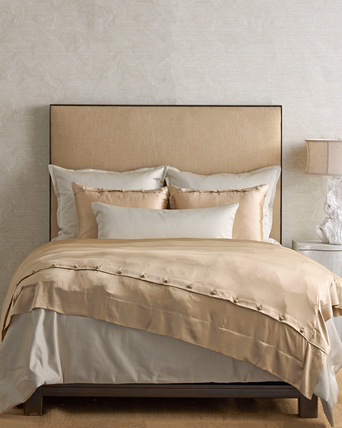 Charmeuse Silk Duvet Cover in Pumice by Ann Gish, styled on a bed with matching shams