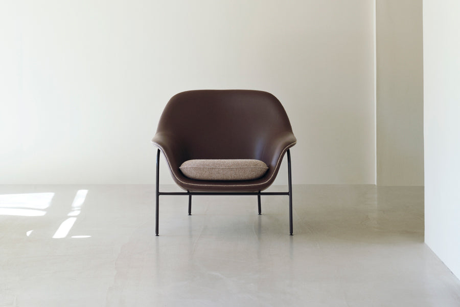 Drape Lounge Chair by Normann Copenhagen, showing drape lounge chair in live shot.