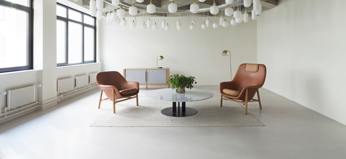 Drape Lounge Chair by Normann Copenhagen, showing drape lounge chair in live shot.