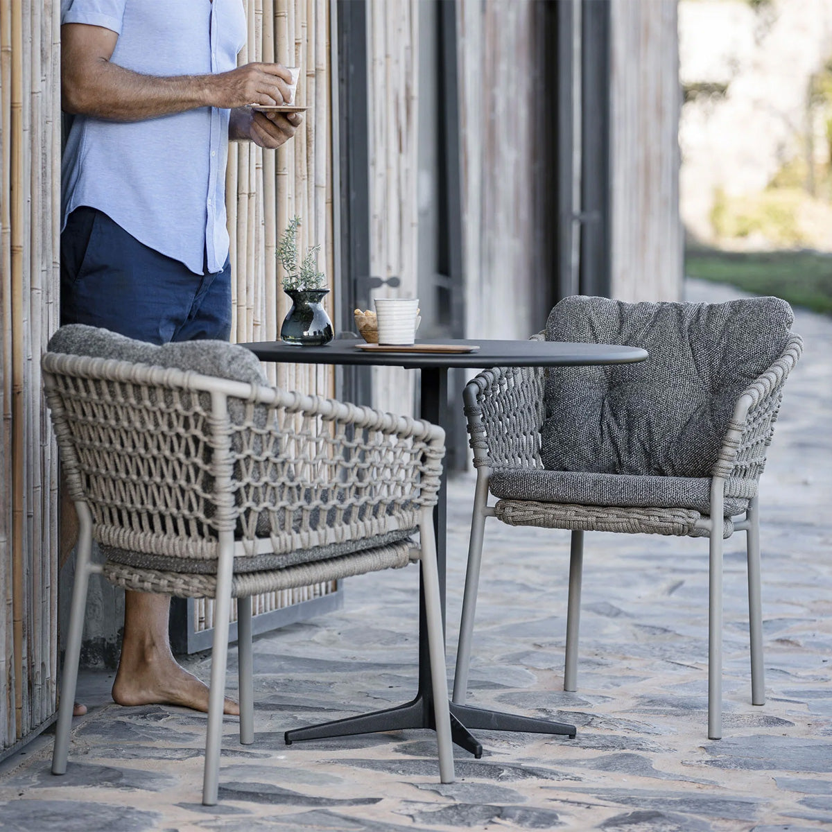 Drop 18" Cafe Table by Cane-Line, showing drop 18" cafe table in live shot.