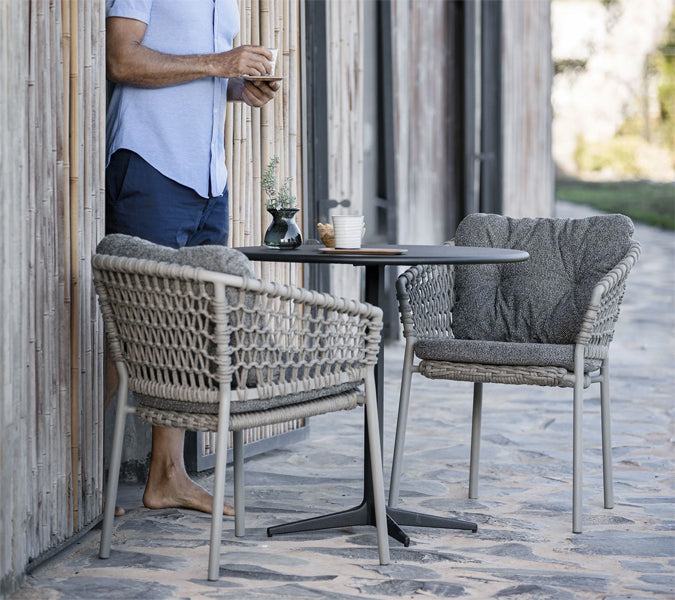 Drop 24" Cafe Table by Cane-Line, showing drop 24" cafe table in live shot.