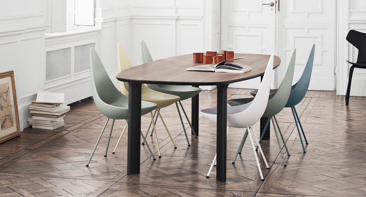 Drop Chair by Fritz Hansen, showing drop chairs in live shot.