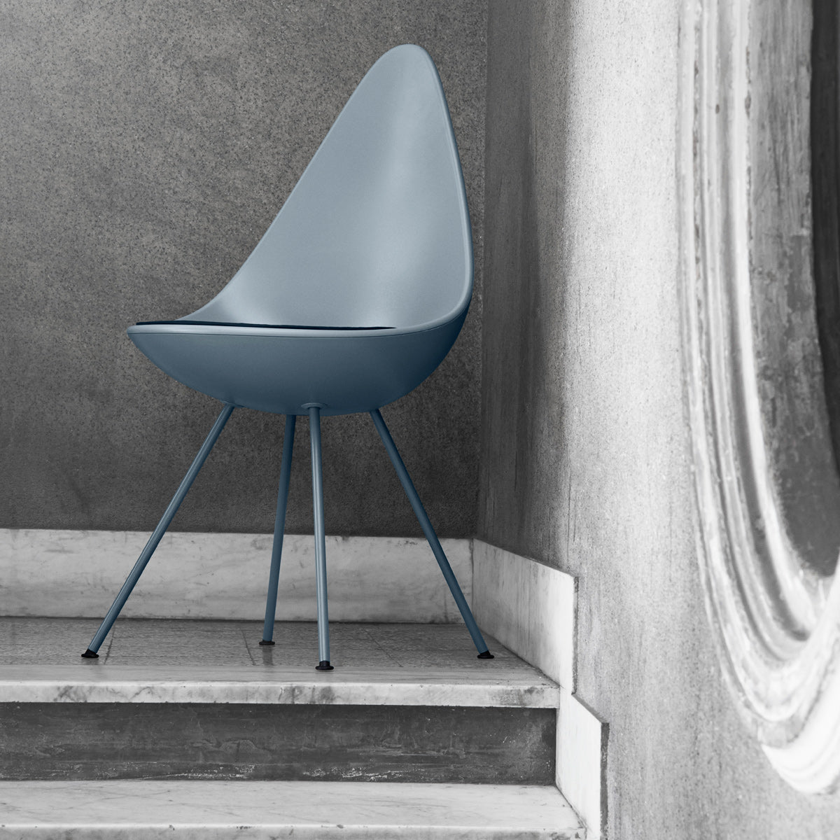 Drop Chair by Fritz Hansen, showing drop chair in live shot.