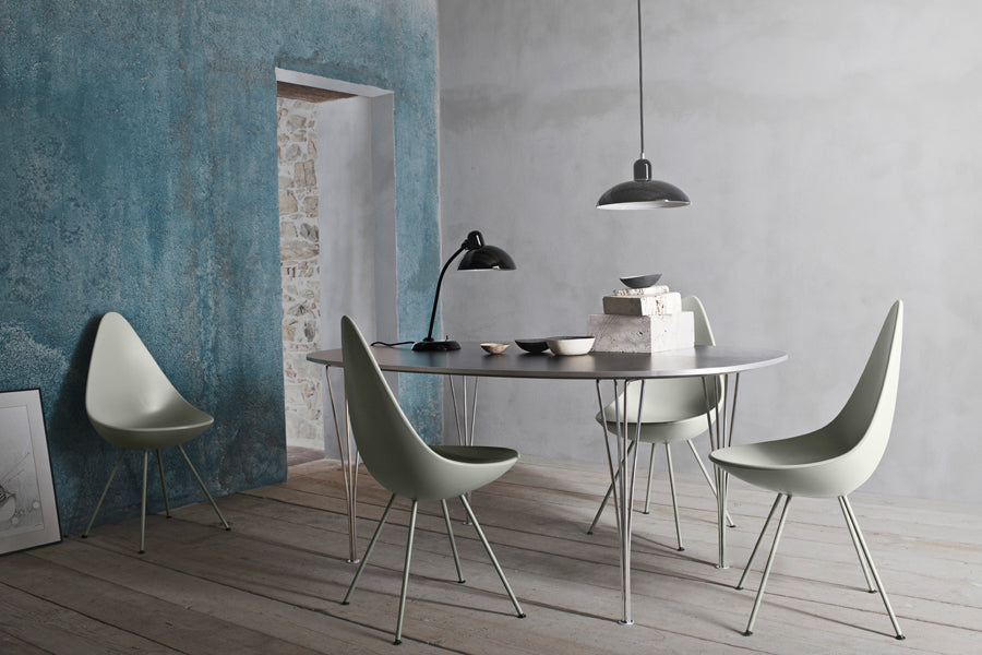 Drop Chair by Fritz Hansen, showing drop chairs in live shot.