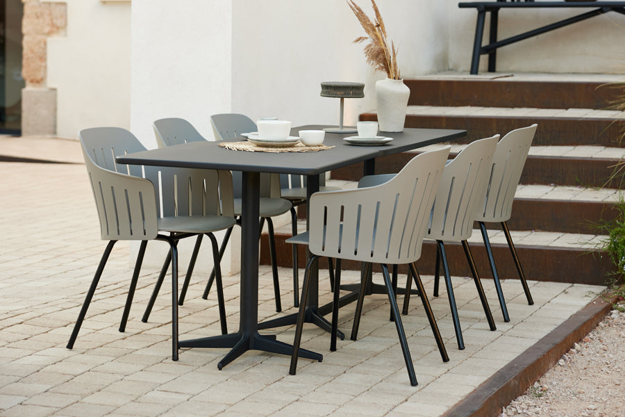 Drop Rectangle Cafe Table by Cane-Line, showing drop rectangle cafe table in live shot.