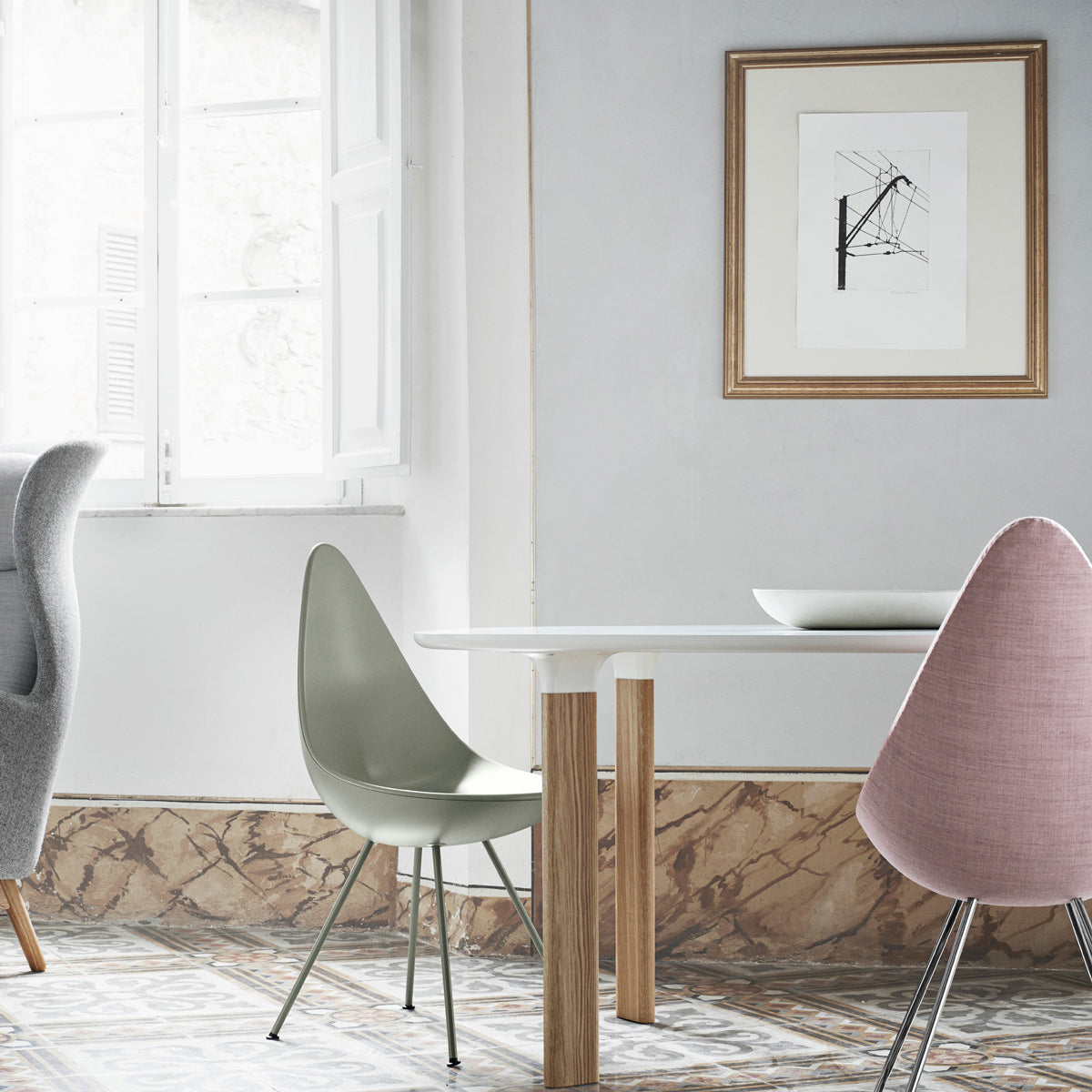 Drop Upholstery Chair by Fritz Hansen, showing drop upholstery chair in live shot.
