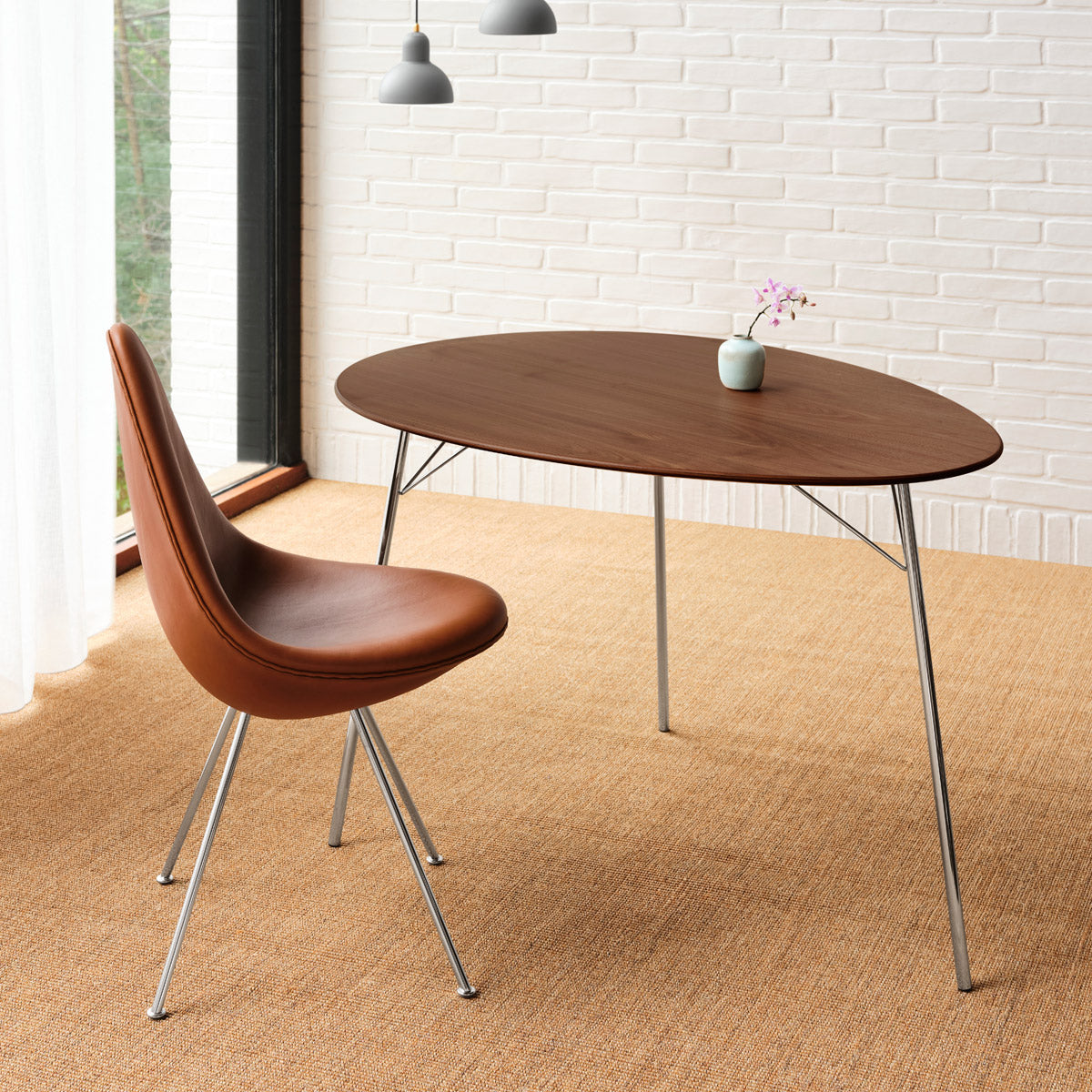 Drop Upholstery Chair by Fritz Hansen, showing drop upholstery chair in live shot.
