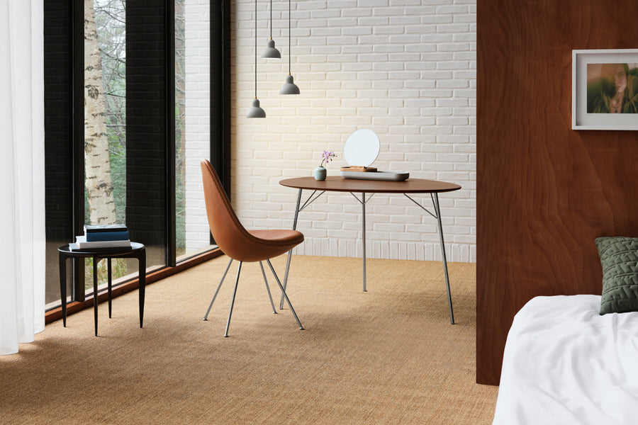 Drop Upholstery Chair by Fritz Hansen, showing drop upholstery chair in live shot.