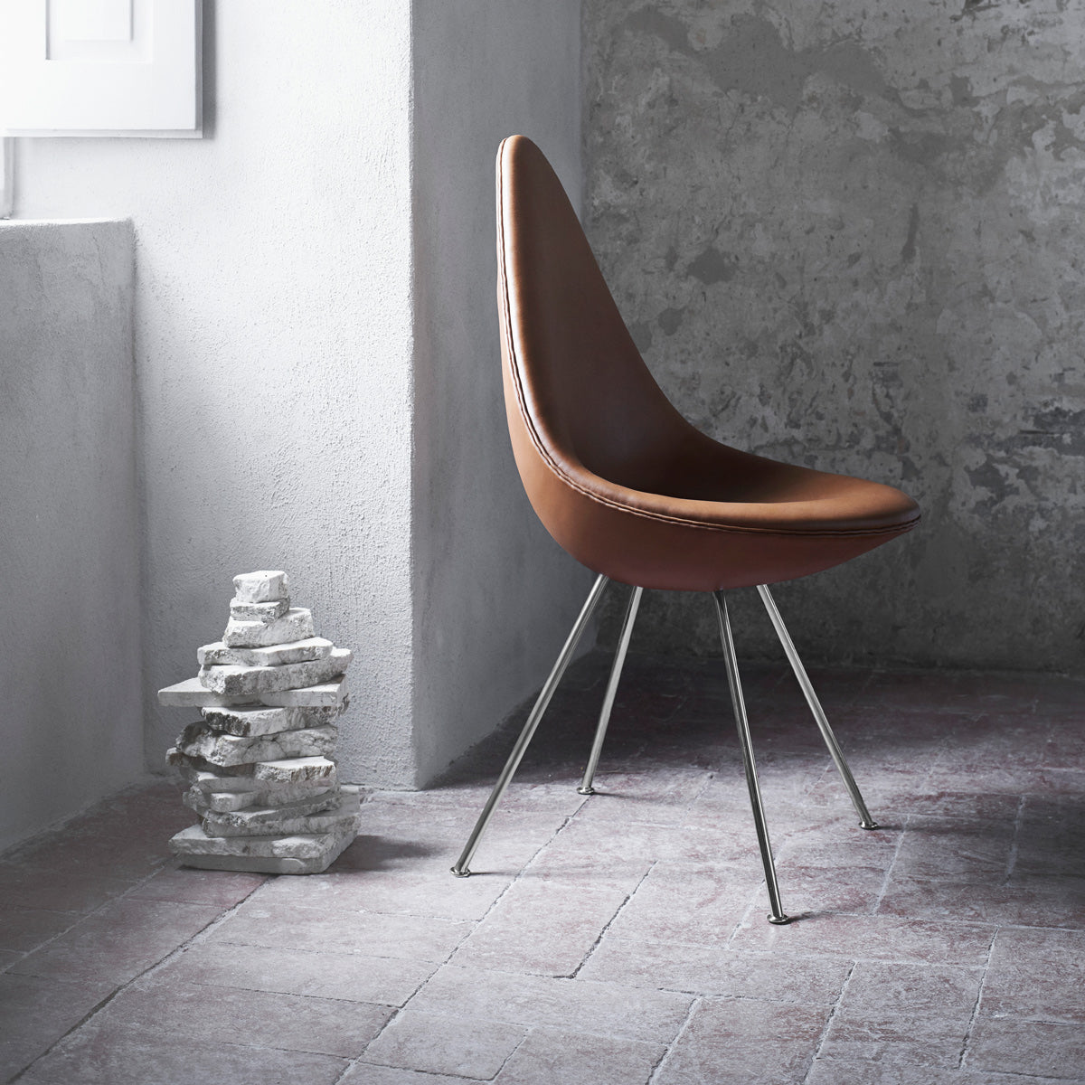 Drop Upholstery Chair with Keder by Fritz Hansen, showing drop upholstery chair with keder in live shot.